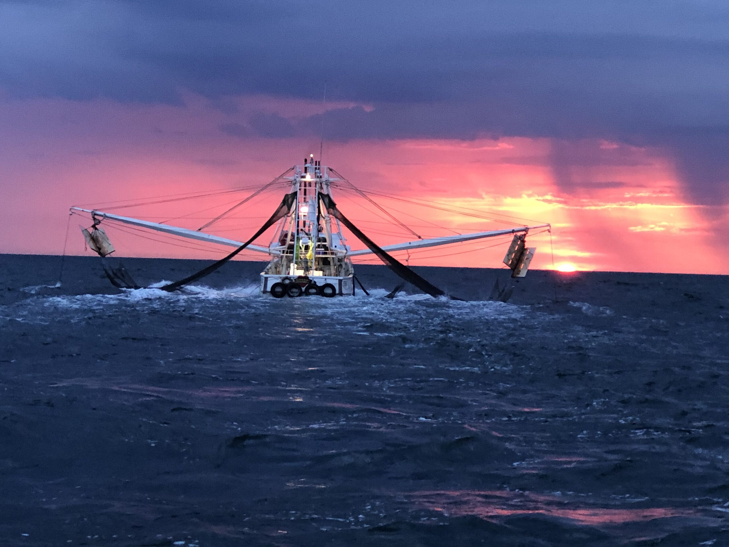 PapaBui's Shrimp Co. Boat under dramatic sky